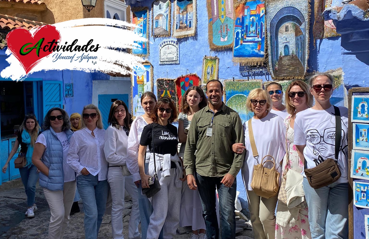 Youssef Ajilyan with a group of visitors in the blue medina of Chefchaouen